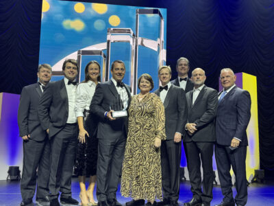 Race Rock CEO Donald Young celebrates with the Race Rock team after receiving the EY Entrepreneur Of The Year® 2026 Gulf South Award.